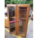 An Ercol two door glazed bookcase, 57 1/2"h x 36"w