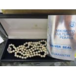 A boxed set of Mikimoto pearls