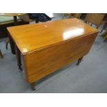 An early 19th century mahogany, gateleg table on turned legs and castors, 29" h x 42"w