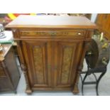 A Victorian mahogany and burr walnut side cabinet having a single drawer, two cupboard doors below