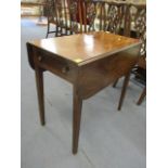 A Georgian mahogany fall flap occasional table having a single inset drawer, standing on tapering