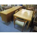 A 1960s Bramin teak dining suite consisting of an extending table, 28"h x 53" w, six chairs and a