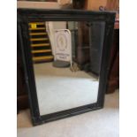 A black framed rectangular mirror A/F