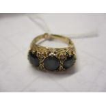 A 9ct gold sapphire and diamond chip set ring