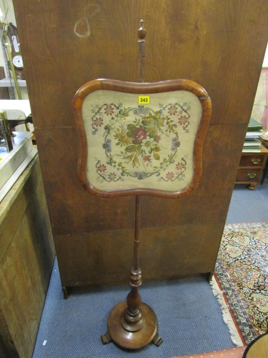 A Victorian walnut pole screen with an embroidered panel