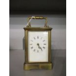 A late 19th century Payne & Co five window, brass carriage clock