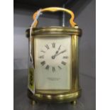A modern Garrards & Co oval, five window brass carriage clock