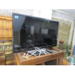 An LG 28" flatscreen television with remote