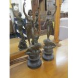 A pair of late Victorian spelter figures each on a wooden base