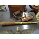 An early 20th century military-issue brass and leather telescope by Tele-Sct Regts Mk II H.C.R and