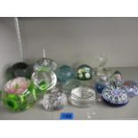 A quantity of glass paperweights to include Caithness