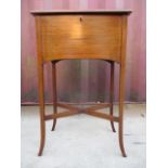 An Edwardian string inlaid mahogany sewing box having a hinged lid with an orange fabric lined,