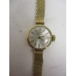 A Girard Perregaux ladies manual wind, 9ct gold cased wristwatch having a silvered dial, baton