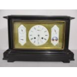 A late 19th century black marble cased clock with perpetual calendar, central dial with Roman