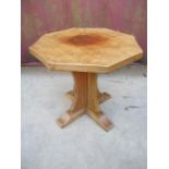 A Robert Thompson Mouseman oak occasional table with an octagonal carved honeycomb top, over a