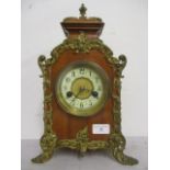 A late 19th/early 20th century ormolu mounted, continental mantle clock in a walnut case, the