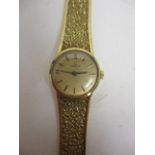 An Omega ladies manual wind, 9ct gold cased wristwatch, having gilt dial, baton markers with