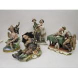 A group of four Galli Capodimonte figurines to include one of two fishermen, a fisherman asleep