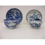 A late 18th century, possibly Liverpool, blue and white tea bowl and saucer decorated with buildings