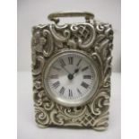 A Victorian miniature, silver cased carriage clock, having a white enamelled dial with Roman