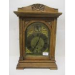 A late 19th/early 20th century oak bracket clock having an 8 day movement by Gustav Becker, gilt