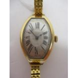 An Art Deco manual wind, 18ct gold wristwatch having silvered dial with Roman numerals and spade