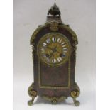 A late 19th century boulle work mantle clock having gilt metal decoration, arched case, basket of