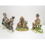 A group of four Capodimonte porcelain figurines, two Galli figures to include a huntsman and his dog