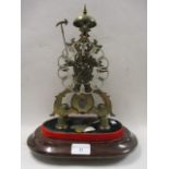 A 19th century brass skeleton clock having a silvered dial with Roman numerals and an eight day