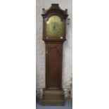 A George III oak longcase clock by Thomas Fordham, Braintree, having a brass dial with Roman