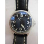 A Sinn 656 gents automatic wristwatch having a black dial, white marks, Arabic numerals and date