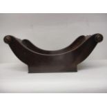 A George III mahogany cheese coaster with turned handles, on a rectangular base, 7" h, 16 1/2"w, 9"d