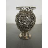 A Dutch 2nd standard purity silver vase with a pierced design of a bird amongst scrolling foliage,