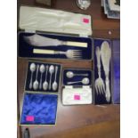 A mixed lot to include two silver cased teaspoons, silver plated fish servers x 2, both in cases and