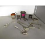 A selection of silver and silver plate to include a cream jug, spoons, napkin rings and other items