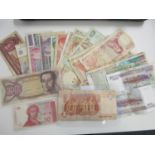 A selection of various banknotes from around the world to include Greek, Spanish, Cambodia and