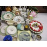 A mixed lot of ceramics to include a Beatrix Potter clock plate, a model penguin, tableware and