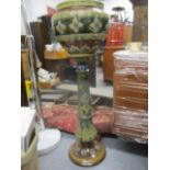 A Royal Doulton stoneware jardiniere and stand, decorated with flowers and foliage A/F, 41" h