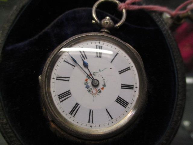 A 19th century silver pocket watch with an enamelled face and floral design, cased - Image 3 of 4