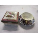 A 19th century German trinket box, together with a miniature Derby cup and saucer