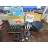 A vintage Atari console, a boxed child's toy sewing machine and a HD PUR 2 gaming edition