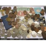 A quantity of mixed coinage and bank notes, mainly British to include florins, crowns, half