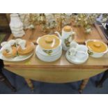 A quantity of retro Meakin tableware with a gooseberry and apple design