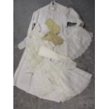 A vintage night gown, four vintage children's lace night gowns and three pairs of kid gloves