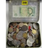 A quantity of Victorian and later commemorative coins and later currency, along with a £1 note,