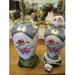 A pair of late 20th century Oriental style ceramic table lamps decorated with flora