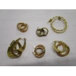 A selection of various 9ct gold and yellow metal hoop earrings, total weight 16.95g