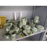 A selection of green Wedgwood Jasperware to include pin dishes, ashtrays and vases