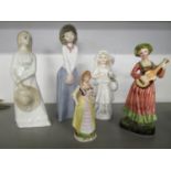 A group of porcelain figures to include Nao