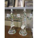 A pair of late 19th century Sitzendorf figural candlesticks